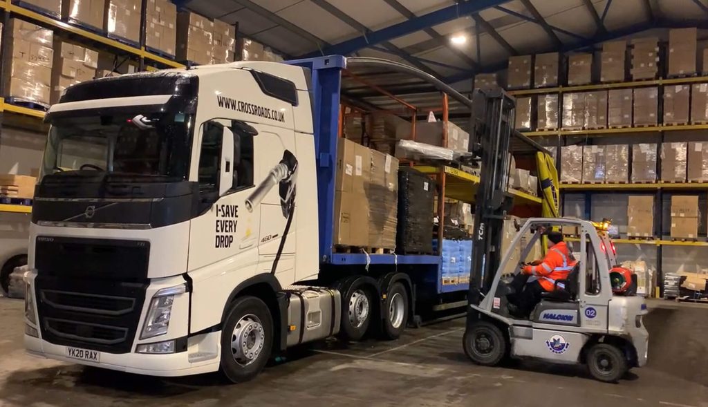 A container being offloaded and palletised at a UK logistics hub, supporting nationwide distribution for importers.