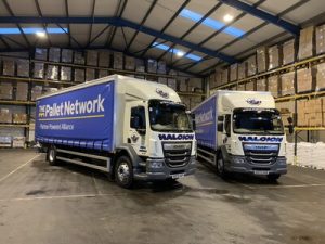 Two lorries positioned inside Halcion’s Stafford‑serving warehouse ready for regional distribution